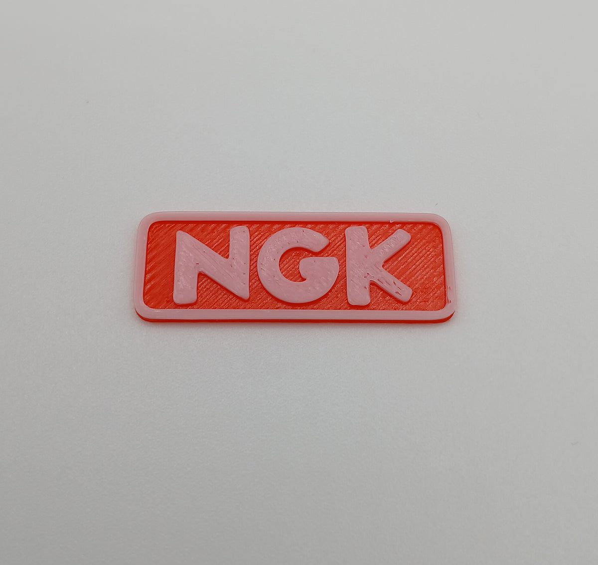 1:64 Scale Orange NGK Racing Banner – 3D Printed Garage Accessory