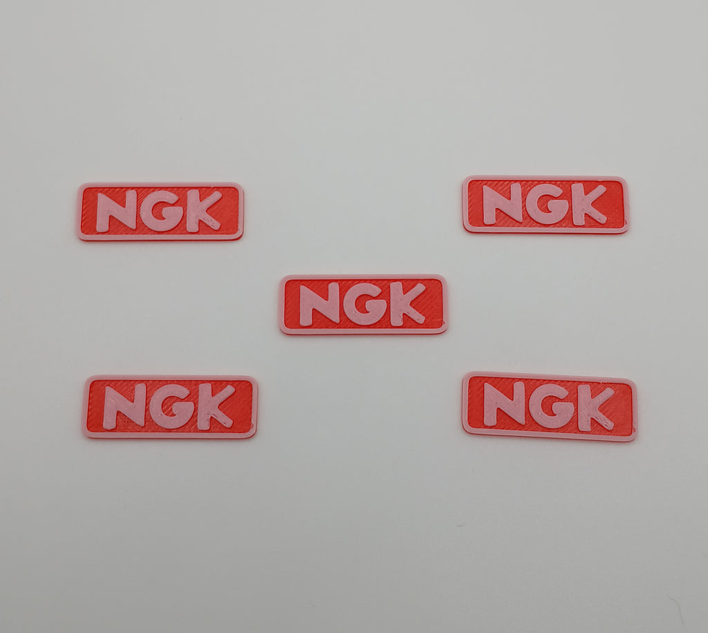1:64 Scale Orange NGK Racing Banner – 3D Printed Garage Accessory