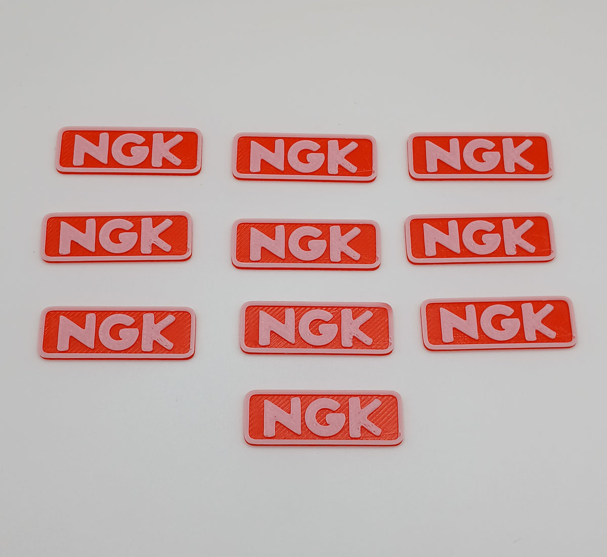 1:64 Scale Orange NGK Racing Banner – 3D Printed Garage Accessory